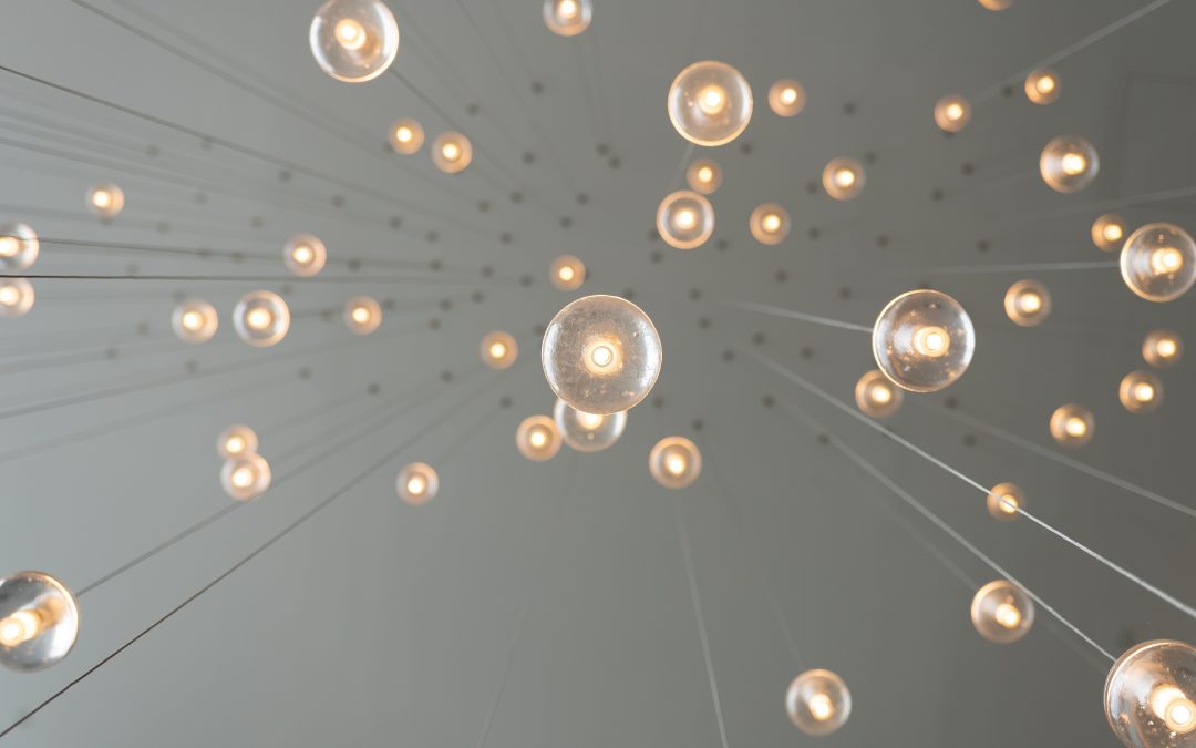 image of lightbulbs hanging like a chandelier, advertising blog titled Good Governance: The Secret Sauce to Innovation
